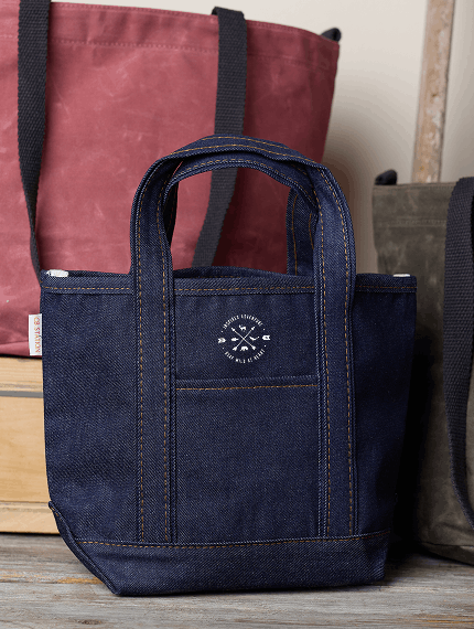 Stack of embroidered tote bags