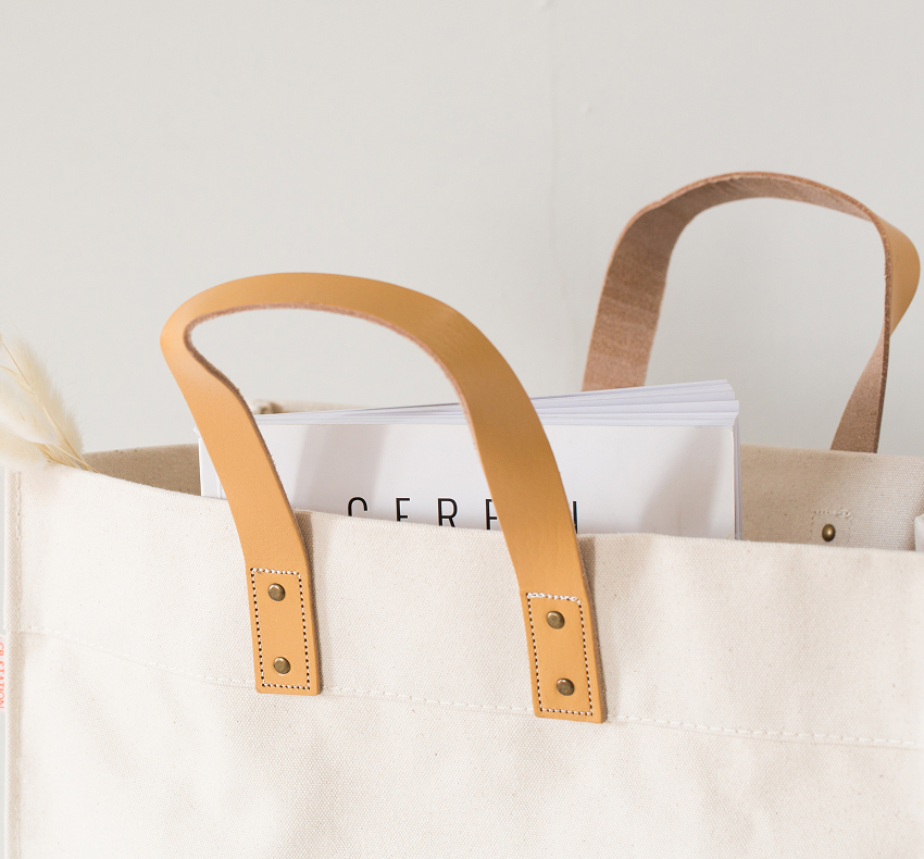 Close-up of canvas tote bag handles and stitching