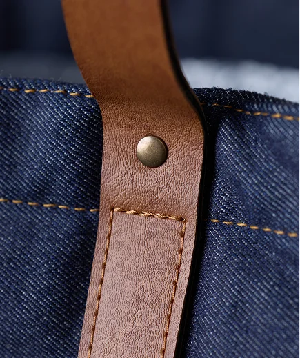 Heritage denim bag leather strap and hardware detail
