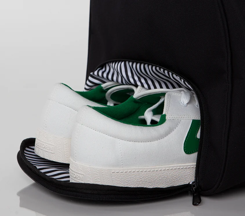 Sports bag ventilated shoe compartment with sneakers inside