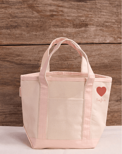 Icon embroidery on the side top of a tote bag