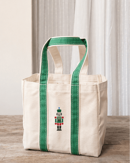 Icon embroidery on the back of a tote bag