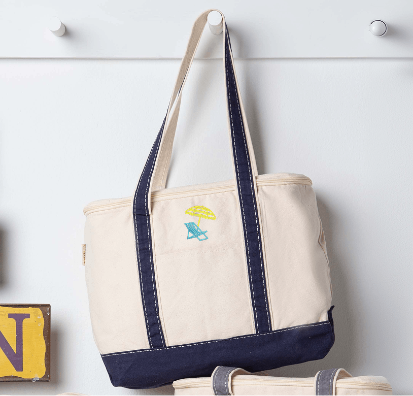 Cream canvas tote with embroidered beach chair and umbrella icon