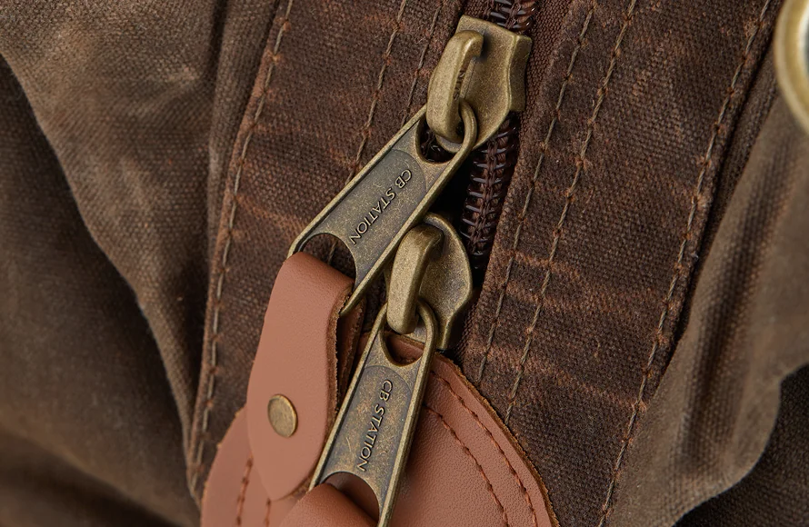 Heavy-duty waxed canvas zipper and seam detail